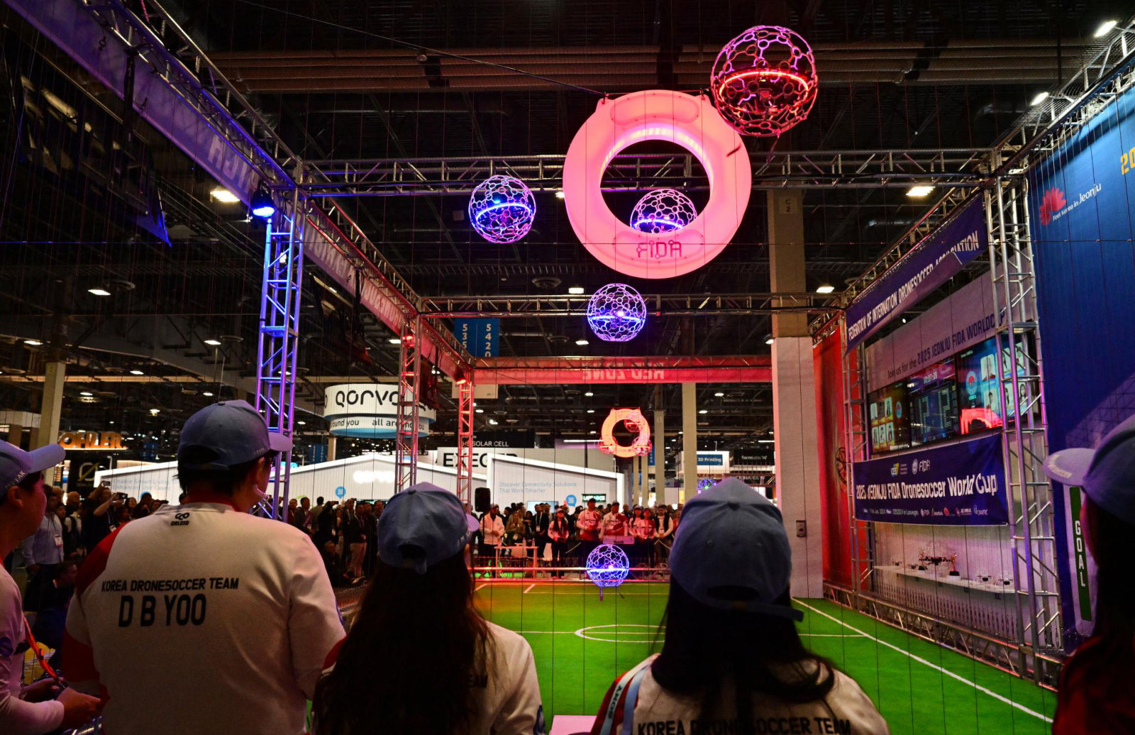 Drone balls flying near goal rings in an enclosed arena